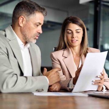 Man and woman looking at cv