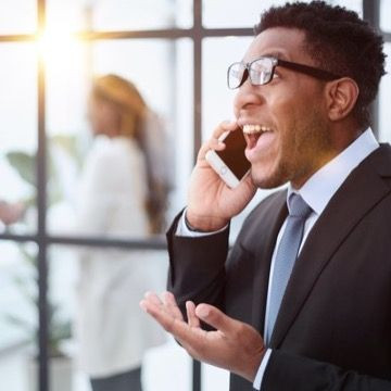 Man laughing on phone